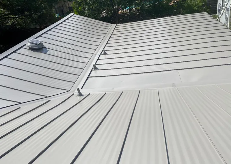 Solar attic fan installed on a metal roof for Roof Ventilation in Lake Geneva
